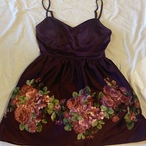 burgundy colored with flowers, has pockets, spaghetti strap
